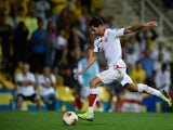 Sevilla's Victor Machin scores the opening goal against Estoril during their Europa League group match on September 19, 2013
