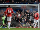 United striker Wayne Rooney opens the scoring against Bayer Leverkusen on September 17, 2013