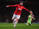 Man United striker Wayne Rooney celebrates scoring his second goal against Bayer Leverkusen on September 17, 2013