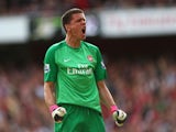 Wojciech Szczesny of Arsenal celebrates after Olivier Giroud of Arsenal scores their first goal during the Barclays Premier League match between Arsenal and Tottenham Hotspur at Emirates Stadium on September 01, 2013 
