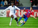 City midfielder Yaya Toure fights for possession with Milan Petrzela of Viktoria Plzen on September 17, 2013