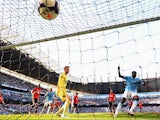 Manchester City's Yaya Toure scores his team second goal against Manchester United during their Premier League match on September 22, 2013