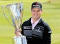 Zach Johnson holds the trophy as he celebrates winning the BMW Championship on September 16, 2013