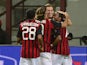 AC Milan's Slovenian midfielder Valter Birsa is congratulated by his teammates after scoring during the Serie A football match AC Milan vs Sampdoria, on Septembre 28, 2013