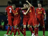 Liverpool's Adam Morgan celebrates scoring from 50 yards out against Manchester City's Under-21s on September 23, 2013