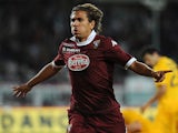 Torino's Alessio Cerci celebrates after scoring his team's second goal against Hellas Verona during their Serie A match on September 25, 2013