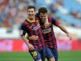 Lionel Messi of FC Barcelona celebrates with team-mate Cesc Fabregas after scoring the opening goal during the La Liga match between UD Almeria and FC Barcelona on September 28, 2013