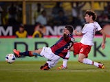 AC Milan's Andrea Poli scores the opening goal against Bologna during their Serie A match on September 25, 2013
