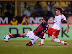 Milan earn last-gasp draw in Bologna thriller