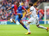 Cameron Jerome of Crystal Palace holds off Chico Flores of Swansea City during the Barclays Premier League match between Crystal Palace and Swansea City at Selhurst Park on September 22, 2013