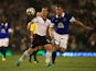 Everton's Darren Gibson and Fulham's Scott Parker battle for the ball during their League Cup match on September 24, 2013