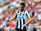 Davide Santon of Newcastle United runs with the ball during the Barclays Premier League match between Newcastle United and Fulham at St James' Park on August 31, 2013