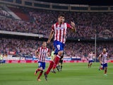 Atletico Madrid's Diego Costa celebrates after scoring his second goal against Osasuna during their La Liga match on September 24, 2013