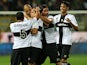 Parma's Djamel Mesbah is congratulated by teammates after scoring the opening goal against Atalanta during their Serie A match on September 25, 2013