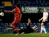 England's Ellen White scores a goal against Turkey on September 26, 2013