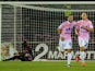 Evian's French forward Kevin Berigaud celebrates with a teammate after scoring a goal during a French L1 football match between Evian and Bordeaux on September 28, 2013