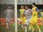 Juventus' Fabio Quagliarella scores his team's equaliser against Chievo Verona during their Serie A match on September 25, 2013