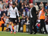 Bryan Ruiz of Fulham celebrates his goal with manager Martin Jol during the Barclays Premier League match between Fulham and Cardiff City at Craven Cottage on September 28, 2013