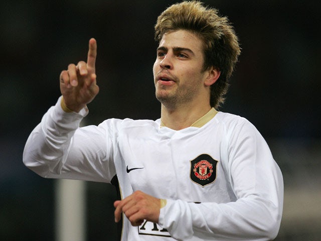 Manchester United's Spanish defender Gerard Pique jubilates after scoring against AS Roma during their UEFA Champions League Group F football match in Rome's Olympic Stadium 12 December 2007