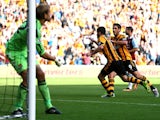 Robbie Brady of Hull City is congratulated by teammate Danny Graham #9 after scoring the opening goal from the penalty spot during the Barclays Premier League match between Hull City and West Ham United at KC Stadium on September 28, 2013