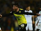 Watford's Javier Acuna celebrates after scoring the opening goal against Norwich during their League Cup match on September 24, 2013