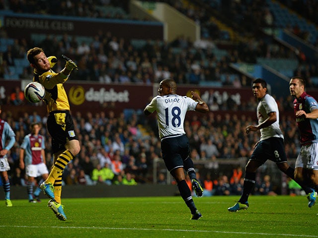 Tottenham's Jermain Defoe scores the opening goal against Aston Villa during their League Cup match on September 24, 2013