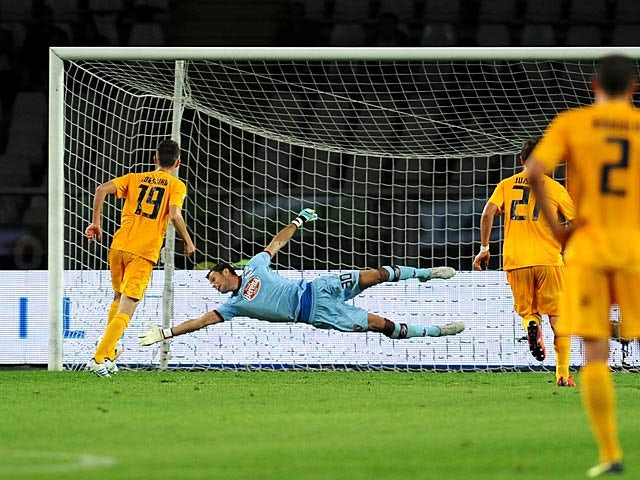 Hellas Verona's Jorge Luiz Frello scores his team's second goal against Torino during their Serie A match on September 25, 2013