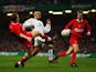 Juan Sebastian Veron attempts to keep possession from  Dietmar Hamann and John Arne Riise during the 2003 League Cup final.