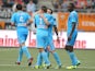 Marseille's French midfielder Mathieu Valbuena celebrates after scoring a goal with his teammate Marseille's French forward Dimitri Payet during the L1 football match between Lorient and Marseille on September 28, 2013