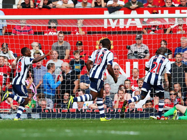 Saido Berahino of West Bromwich Albion celebrates with team mates after scoring during the Barclays Premier League match between Manchester United and West Bromwich Albion at Old Trafford on September 28, 2013