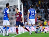 Barcelona's Marc Bartras celebrates after scoring his team's fourth goal against Real Sociedad during their La Liga match on September 24, 2013