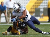 Michael Griffin #33 of the Tennessee Titans hits Antonio Brown #84 of the Pittsburgh Steelers in the second half during the game on September 8, 2013
