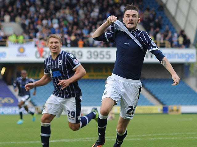 Scott Malone of Millwall celebrates after scoring the teams second goal during the Sky Bet Championship match between Millwall and Leeds United at The Den on September 28, 2013