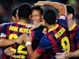 Barcelona's Neymar is congratulated by teammates after scoring the opening goal against Real Sociedad during their La Liga match on September 24, 2013