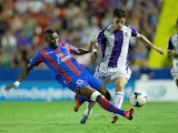 Real Valladolid's Omar Ramos and Levante's Papa Diop battle for the ball during their La Liga match on September 24, 2013