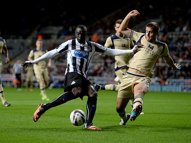 Newcastle's Papiss Cisse scores the opening goal against Leeds during their League Cup match on September 25, 2013