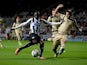 Newcastle's Papiss Cisse scores the opening goal against Leeds during their League Cup match on September 25, 2013