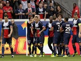 Paris Saint-Germain's players celebrate after Brazilian defender Marquinhos scored a goal during the French L1 football match between Paris Saint-Germain and Toulouse at the Parc des Princes Stadium in Paris on September 28, 2013