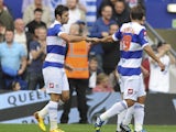 Charlie Austin of Queens Park Rangers celebrates with his teammates after scoring a goal from the penalty spot during the Sky Bet Championship match between Queens Park Rangers and Middlesbrough at Loftus Road on September 28, 2013