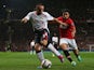 Man United's Rafael and Liverpool's Jose Enrique battle for the ball during their League Cup match on September 25, 2013
