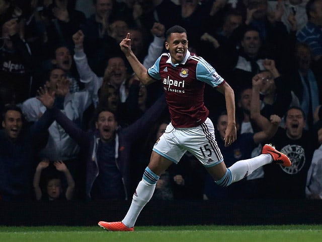 West Ham's Ravel Morrison celebrates after scoring the opening goal against Cardiff during their League Cup match on September 24, 2013