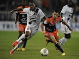 Montpellier's Remy Cabella vies with Rennes' forward Abdoulaye Sane during a match on September 26, 2013