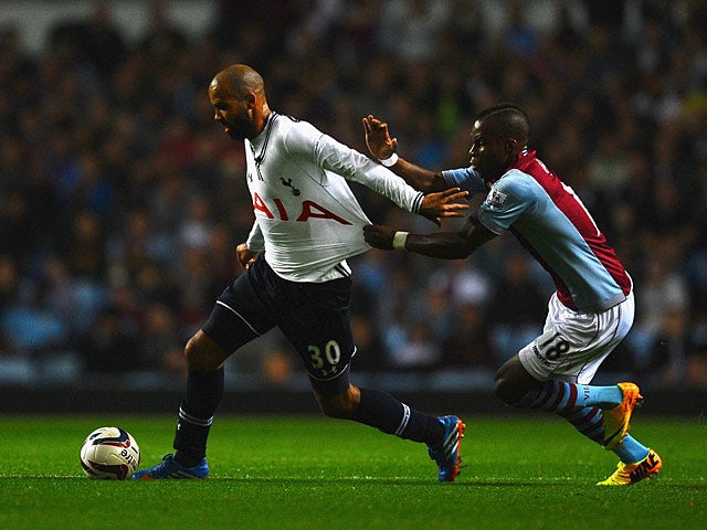 Tottenham's Sandro and Villa's Yacouba Sylla battle for the ball during their League Cup match on September 24, 2013