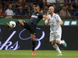 Saphir Taider of FC Inter Milan and Borja Valero of ACF Fiorentina compete for the ball during a match on September 26, 2013