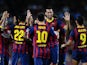 Barcelona's Sergio Busquets is congratulated by teammates after scoring his team's third goal against Real Sociedad during their La Liga match on September 24, 2013