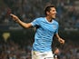 Man City's Stevan Jovetic celebrates after scoring his team's fourth goal against Wigan during their League Cup match on September 24, 2013