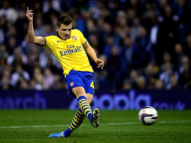 Arsenal's Thomas Eisfeld scores the opening goal against West Brom during their League Cup match on September 25, 2013