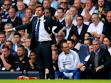 Andre Villas-Boas manager of Tottenham Hotspur signals as Jose Mourinho manager of Chelsea looks on during the Barclays Premier League match between Tottenham Hotspur and Chelsea at White Hart Lane on September 28, 2013