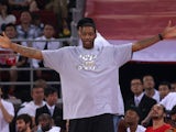 NBA star Tracy McGrady watches the Yao Foundation Charity Game, sponsored by the charity foundation initiated by former Chinese basketball star Yao Ming, during the 2013 Yao Foundation Charity Game between China team and the NBA Stars team on July 1, 2013
