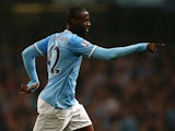 Man City's Yaya Toure scores his team's third goal against Wigan during their League Cup match on September 24, 2013